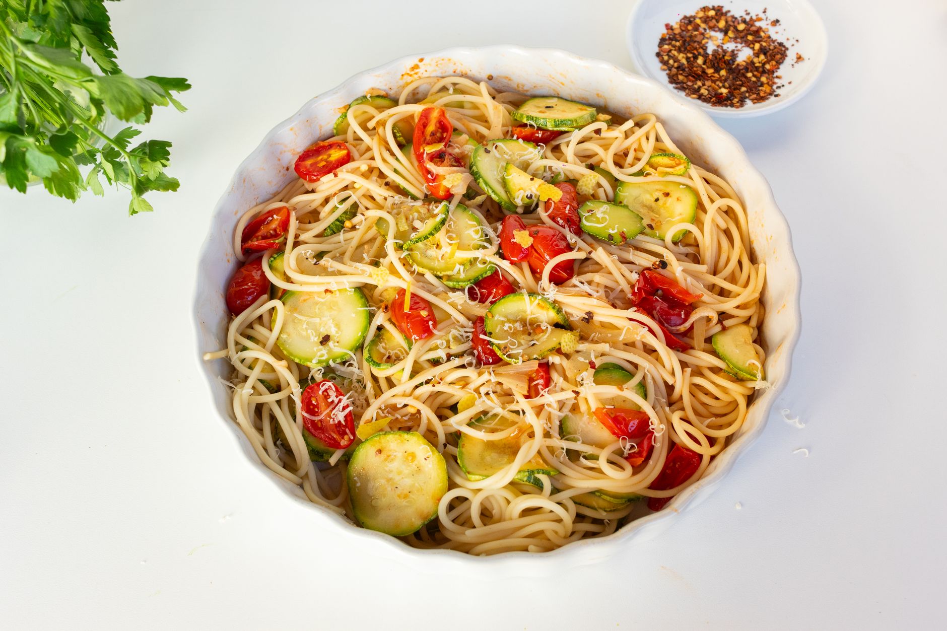 Appetizing pasta dish with zucchini and cherry tomatoes. Perfect for healthy dining.