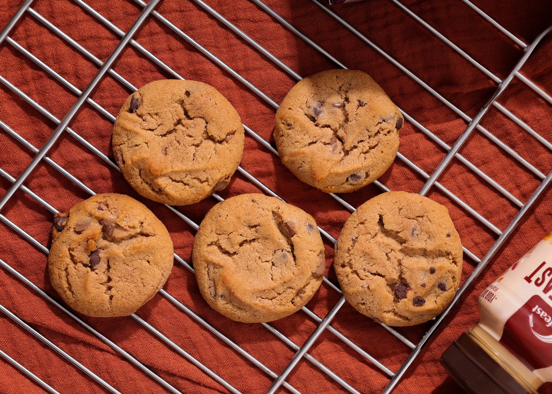 Top view of homemade chocolate chip cookies on a cooling rack.